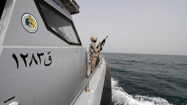 A Saudi border guard watches as he stands in a boat off the coast of the Red Sea on Saudi Arabia's maritime border with Yemen, near Jizan April 8, 2015. Iran sent two warships to the Gulf of Aden on Wednesday, state media reported, establishing a military presence off the coast of Yemen where Saudi Arabia is leading a bombing campaign to oust the Iran-allied Houthi movement. REUTERS