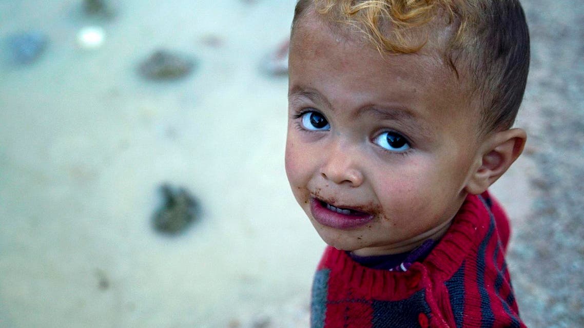 A child plays at a refugee camp on the northeastern Greek island of Chios, Wednesday, Sept. 28, 2016. Over 60,000 migrants remain stranded on Greece's mainland and the islands since European border closures earlier this year. Under the EU-Turkey deal, migrants who arrived in Greece after March 20 can be deported back to Turkey. (AP Photo/Mstyslav Chernov)