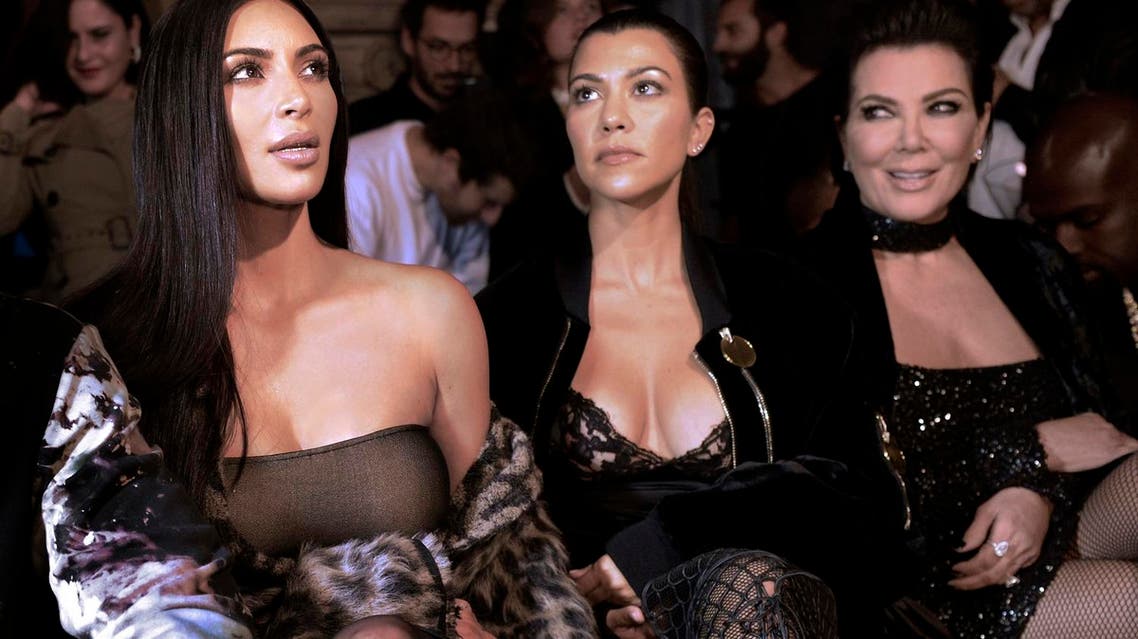 From L) Kim Kardashian, Kourtney Kardashian and Kris Jenner attend the Off-white 2017 Spring/Summer ready-to-wear collection fashion show, on September 29, 2016 in Paris. ALAIN JOCARD / AFP