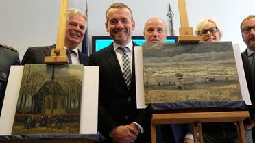 AFP Axel Ruger (C), Director of the Van Gogh museum poses next to two recently recovered stolen paintings by late Dutch artist Vincent Van Gogh entitled "Congregation Leaving the Reformed Church in Nuenen" (L) and "The Beach At Scheveningen During A Storm" (R) in Naples on September 30, 2016. 