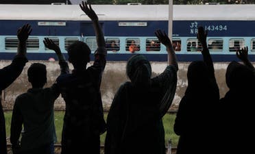 People see off passengers traveling to neighboring India at a railway station in Lahore, Pakistan, Monday, Sept. 26, 2016. AP