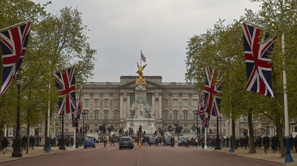 Britain's Union flags line the Mall leading to Buckingham Palace (Background) in central London on May 2, 2015. AFP