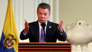 olombia's President Juan Manuel Santos acknowledges the applause while addressing people who worked for the peace accord to be approved in the recent referendum, after winning the Nobel Peace Prize, at Narino Palace in Bogota, Colombia, October 7, 2016. REUTERS