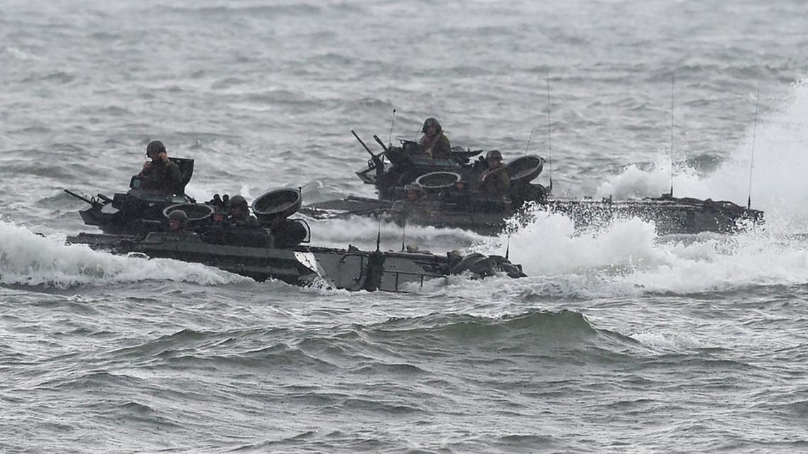 US marines Amphibious Assault vehicles (AAV) manoeuver on rough seas during a beach landing, as part of the Philippines-US amphibious landing exercise (PHIBLEX) at a naval training base facing South China sea in San Antonio town, Zambales province, north of Manila on October 7, 2016. Philippine President Rodrigo Duterte threatened to end joint military exercises with the US after this year, a threat he repeated October 7 saying: "This year would be the last." TED ALJIBE / AFP