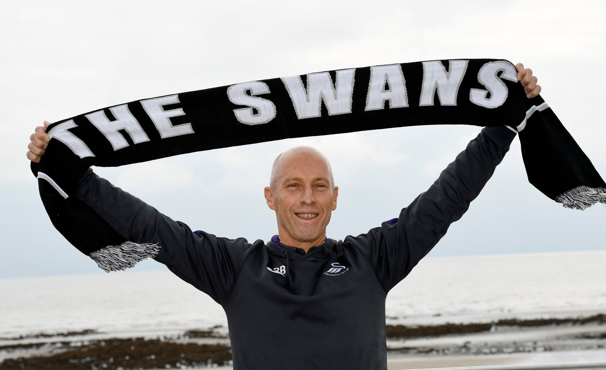 Swansea City manager Bob Bradley poses after the press conference Action Images via Reuters