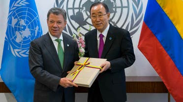 In this Sept. 19, 2016 file photo President Juan Manuel Santos of Colombia, left, presents a copy of a peace agreement that was forged in his country to United Nations Secretary-General Ban Ki-moon during a meeting at the United Nations headquarters. (AP)