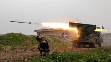 Al-Furqan brigade fighters, part of the Free Syrian Army, launch a Grad rocket towards forces loyal to Syria's president Bashar Al-Assad located in Mork town, Hama. (Reuters)