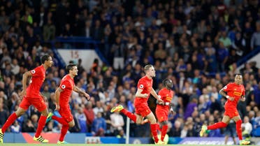 Liverpool's Jordan Henderson, center, celebrates after scoring his side's second goal during the English Premier League soccer match between Chelsea and Liverpool at Stamford Bridge stadium in London, Friday, Sept. 16, 2016. (AP)