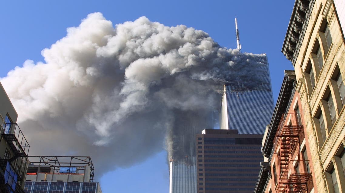 In this Sept. 11, 2001 file photo, the twin towers of the World Trade Center burn after hijacked planes crashed into them in New York. A person familiar with developments said Sunday, May 1, 2011 that Osama bin Laden is dead and the U.S. has the body. (AP