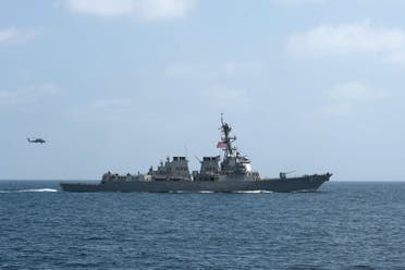 The U.S. Navy guided-missile destroyer USS Mason conducts divisional tactic maneuvers in the Gulf of Oman. (Reuters)