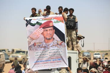 Pro-government soldiers hold a poster of Major-General Abdel-Rab al-Shadadi, a top general in forces loyal to Yemeni President Abd-Rabbu Mansour Hadi's government killed in fighting with Iran-aligned Houthi troops, during his funeral in Marib city, Yemen October 9, 2016. reuters