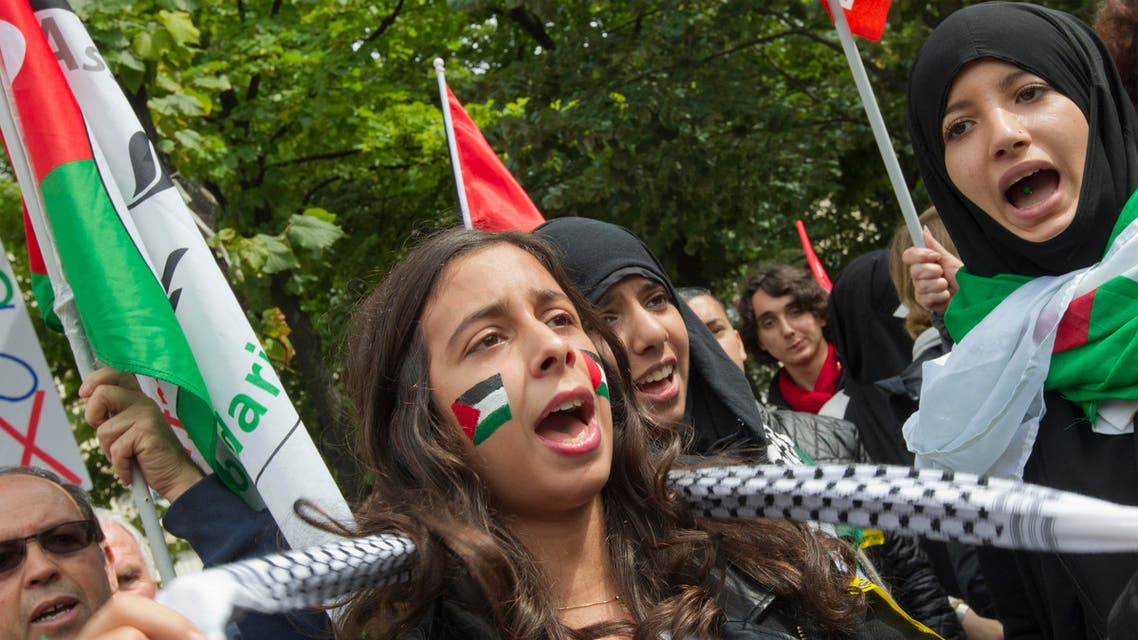 Palestinian youth protest in Paris Friday, July 11, 2014. Some 200 Palestinian activists from the organization Combatants For Peace gathered in Paris to protest against recent acts of violence between Israelis and Palestinians. The number of Palestinians killed in Israel's massive air campaign in Gaza is now over 100. (AP)