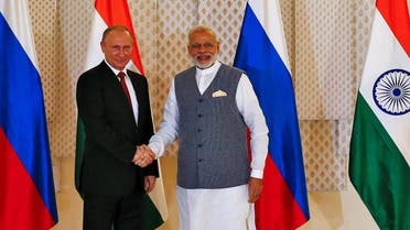 Russian President Vladimir Putin (L) shakes hand with India's Prime Minister Narendra Modi during a photo opportunity ahead of India-Russia Annual Summit in Benaulim, in the western state of Goa, India, October 15, 2016.(Reuters)