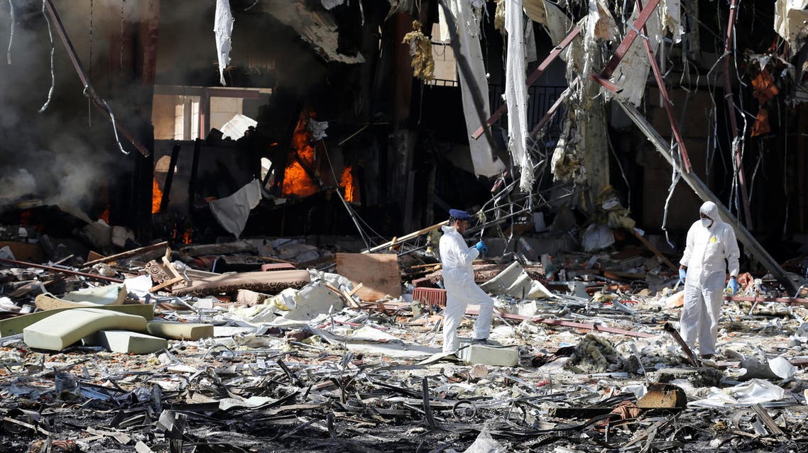 Forensic experts investigate the scene at the community hall where Saudi-led warplanes struck a funeral in Sanaa, the capital of Yemen. REUTERS