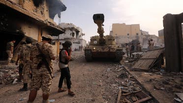 Members of the forces loyal to Libya's UN-backed Government of National Accord (GNA) gather in the coastal city of Sirte, east of the capital Tripoli, during their military operation to clear the Islamic State group's (IS) jihadists from the city, on October 14, 2016. Libya has been ravaged by unrest since the fall and death in 2011 of dictator Moamer Kadhafi and has also seen the jihadist Islamic State group establish a foothold. MAHMUD TURKIA / AFP