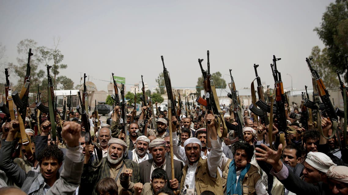 Shiite Houthi tribesmen hold their weapons as they chant slogans during a tribal gathering showing support for the Houthi movement, in Sanaa, Yemen, Thursday, May 26, 2016. (AP