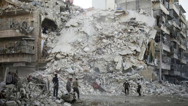 Members of the Syrian Civil Defence, known as the White Helmets, search for victims amid the rubble of a destroyed building following reported air strikes in the rebel-held Qatarji neighbourhood of the northern city of Aleppo, on October 17, 2016. (AFP)