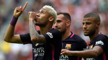 Barcelona's Neymar celebrates his goal with teammates. REUTERS