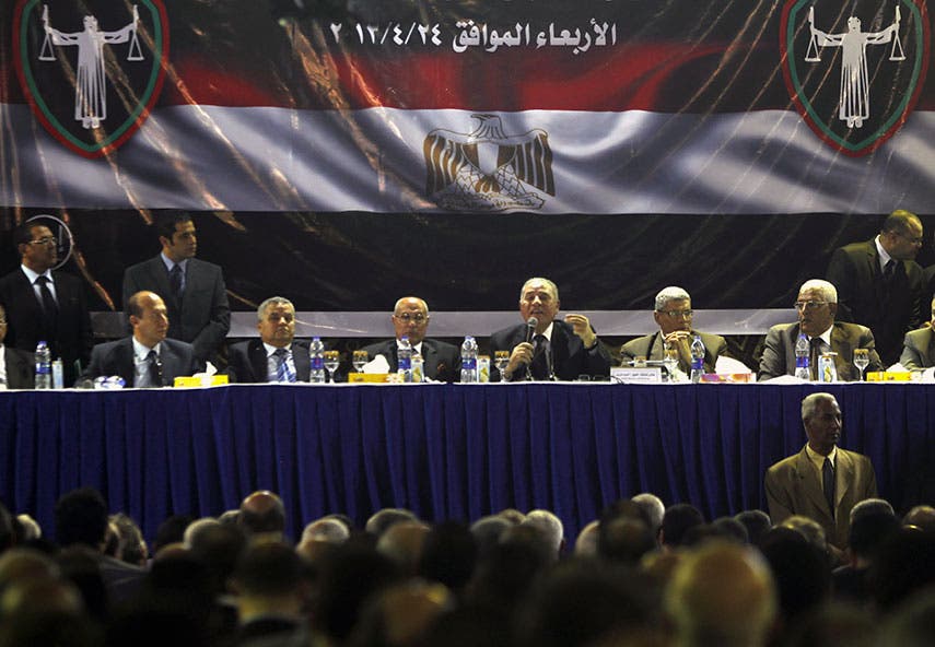 Ahmed al-Zend (with microphone in hand) addresses a meeting of Egyptian judges in April 2013. (File photo: Reuters)