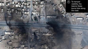 Smoke is seen in this satellite image of the city of Mosul in Iraq. (Reuters)