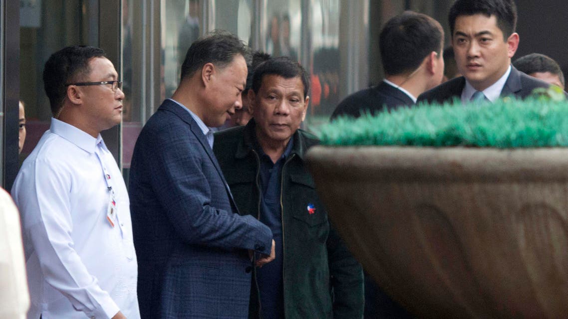 Philippine President Rodrigo Duterte (center) walks out from a shopping mall in Beijing, China, on Wednesday, Oct. 19, 2016. This week's visit to China by Duterte points toward a restoration of trust between the sides following recent tensions over their South China Sea territorial dispute. (AP)