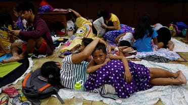 Residents who evacuated their homes due to Typhoon Haima take shelter at an evacuation centre in San Fernando, in northern Philippines, on October 19, 2016. (Reuters) 