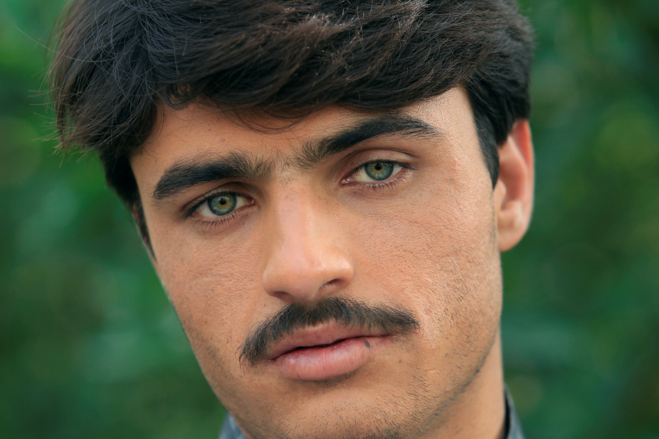 Arshad Khan, formerly a chai wala (tea seller) by profession, poses for a picture after doing a television interview in Islamabad, Pakistan October 20, 2016. reuters