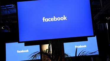 A Facebook logo is pictured on a screen ahead of a press conference to announce the launch of it's latest product "Workplace", in central London on October 10, 2016. Social network giant Facebook launched new global product Workplace, a platform that it hopes will replace intranet, mailbox and other internal communication tools used by businesses worldwide. It is intended to compete with similar office communication products including Microsoft's Yammer, Salesforce's Chatter and Slack.  Justin TALLIS / AFP