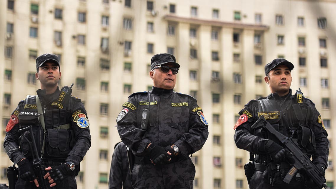 Members of the Egyptian police special forces stand guard on Cairo's landmark Tahrir Square on January 25, 2016 AFP