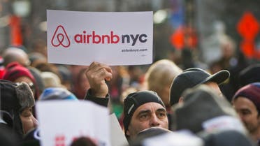 Supporters of Airbnb hold a rally outside City Hall, Tuesday, Jan. 20, 2015, in New York. With home-as-hotel sites like Airbnb doing booming business, New York City lawmakers are holding a hearing to scrutinizing how the trend affects the housing market and economy. (AP)