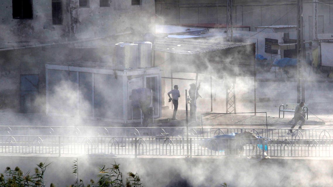 Smoke rises as Kurdish forces take up position at a site of an attack by Islamic State militants in Kirkuk, Iraq, October 21, 2016. REUTERS