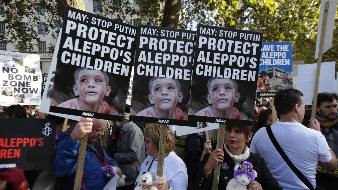Demonstrators hold teddy bears and placards that call on British Prime Minister Theresa May to take action to protect the children of the Syrian city of Aleppo during a rally outside Downing Street in central London on October 22, 2016. Several campaign groups and charities including Avaaz and Amnesty International organised a rally outside Downing Street in London to call on the British government to set out a plan to protect Syrian children in the embattled Syrian city of Aleppo. Hundreds of wounded civilians were stranded in rebel-held areas of Syria's Aleppo on October 22 after the UN said security concerns had prevented evacuation convoys even as Russia extended a ceasefire into a third day. AFP