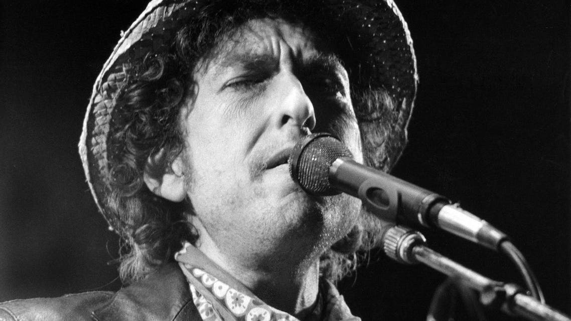 This file photo taken on June 3, 1984 shows US singer Bob Dylan performing during a concert at the Olympic stadium in Munich, southern Germany. US songwriter Bob Dylan won the Nobel Literature Prize on October 13, 2016, the first songwriter to win the prestigious award and an announcement that surprised prize watchers. Istvan Bajzat / DPA / AFP