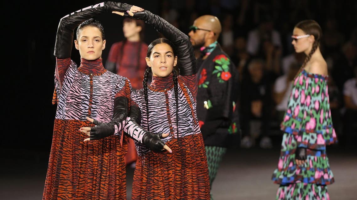 Performers and models take the runway during KENZO x H&M Launch Event Directed By Jean-Paul Goude' at Pier 36 on October 19, 2016 in New York City. Nicholas Hunt/Getty Images for H&M/AFP Nicholas Hunt / GETTY IMAGES NORTH AMERICA / AFP