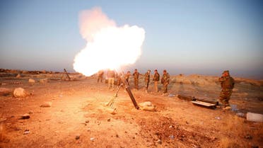 Peshmerga forces fires a mortar towards ISIS militants' positions in the town of Naweran. (Reuters)