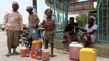 Yemenis sell petrol on the street after Yememi government forces re-entered Zinjibar the capital of the southern Abyan province on August 16, 2016 following an offensive backed by Saudi-led air strikes to recapture the city from Al-Qaeda jihadists. Government forces re-entered the provincial capital of Abyan on August 14 after clashes with Al-Qaeda jihadists who have exploited a power vacuum in Yemen to expand their presence in the country's south and southeast. AFP 