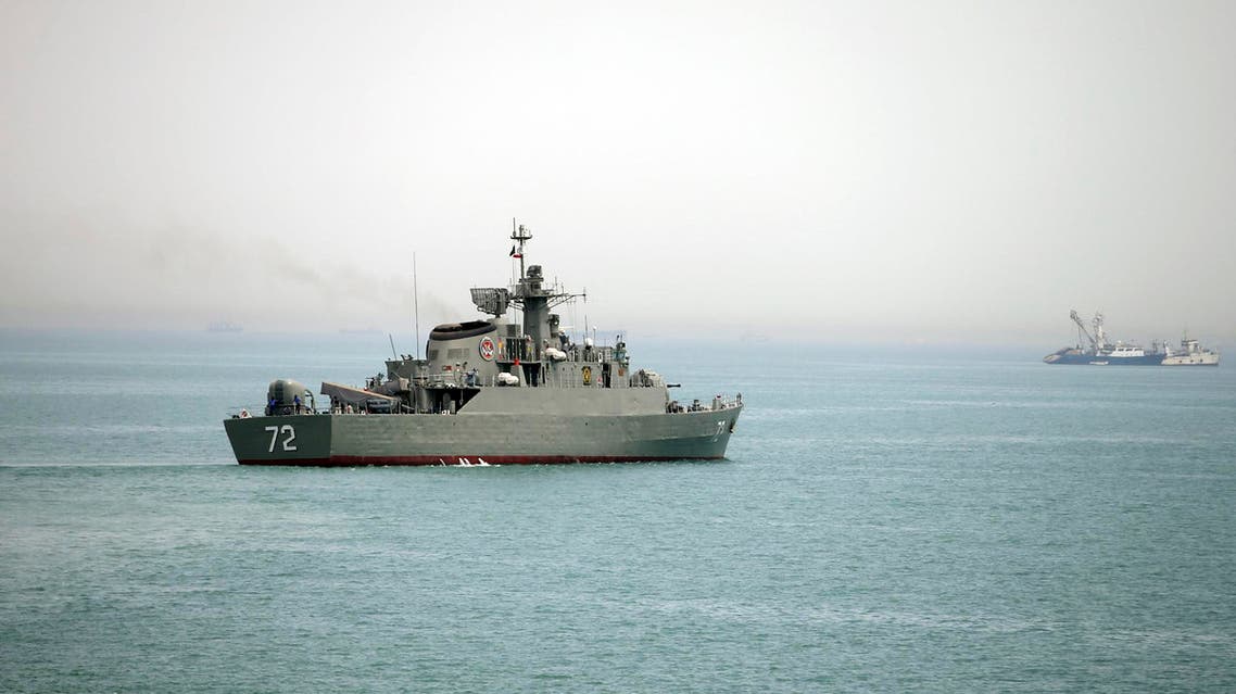 In this Tuesday, April 7, 2015, file photo released by the semi-official Fars News Agency, Iranian warship Alborz, foreground, prepares before leaving Iran's waters, at the Strait of Hormuz. AP