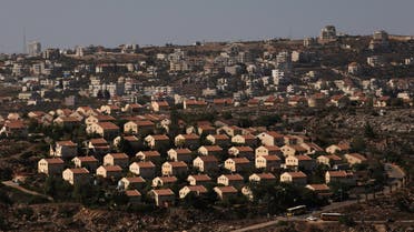 The West Bank Jewish settlement of Ofra is photographed as seen from the Jewish settler outpost of Amona in the West Bank, during an event organised to show support for Amona which was built without Israeli state authorisation and which Israel's high court ruled must be evacuated and demolished by the end of the year as it is built on privately-owned Palestinian land, October 20, 2016. The Palestinian village of Silwad is seen in the background. REUTERS/Ronen Zvulun