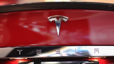  A Tesla motor company car logo sits on a car in a dealership at the Dadeland Mall on June 6, 2013 in Miami, Florida. The electric car maker is trying to make a move by selling their cars, that can cost between $62,400 and $82,400, into malls and stores. Joe Raedle/Getty Images/AFP