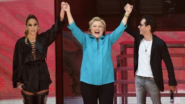 afp MIAMI, FL - OCTOBER 29: Jennifer Lopez, Hillary Clinton and Marc Anthony are seen at the Jennifer Lopez Gets Loud for Hillary Clinton at GOTV Concert in Miami at Bayfront Park Amphitheatre on October 29, 2016 in Miami, Florida. Gustavo Caballero/Getty Images/AFP 