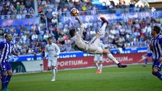 Ronaldo hat-trick keeps Real Madrid top