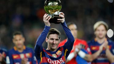 FC Barcelona's Lionel Messi, from Argentina, holds up his Ballon d'Or (Golden Ball) award as European Footballer of the Year prior the Spanish La Liga soccer match between FC Barcelona and Athletic Bilbao at the Camp Nou stadium in Barcelona, Spain, Sunday, Jan. 17, 2016. (AP)