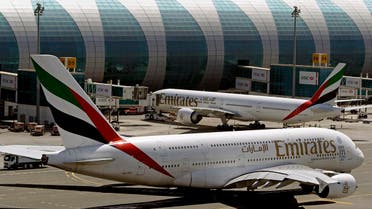 In this May 8, 2014 file photo, Emirates passenger planes are in use at Dubai airport in United Arab Emirates. Dubai Airports said Monday it plans to add 10 more A380 gates with air bridges at Dubai International Airport's Concourse C. That will leave the airport with a world record 47 gates designed for the aircraft. (AP Photo/Kamran Jebreili, File)
