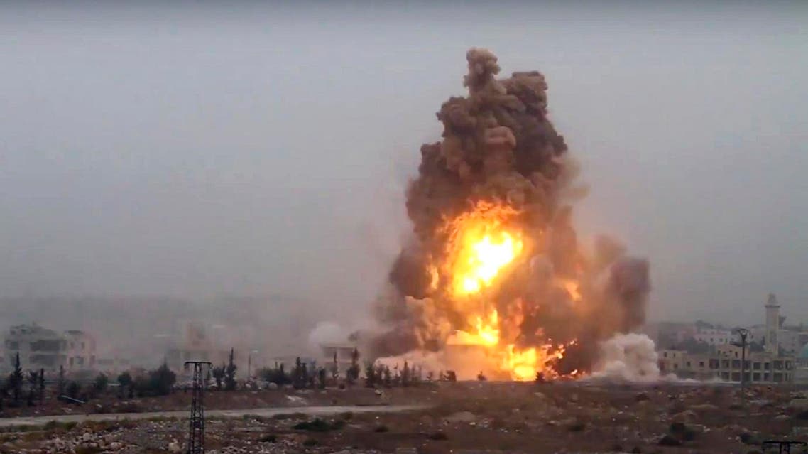 This frame grab from video provided by Thiqa news agency, a Syrian opposition media outlet that is consistent with independent AP reporting, shows flames rises from an explosive vehicle bomb that attacked a Syrian government position, in southwest of Aleppo, Syria, Friday, Oct, 28, 2016. Rebels detonating three vehicle-borne explosives against government positions to the city's southwest and attacking with hundreds of rockets, the Britain-based Syrian Observatory for Human Rights said. It said at least one of the vehicles was driven by a suicide bomber for the al-Qaida-linked Fatah al-Sham Front, which also announced the offensive. (Thiqa News Agency, via AP)
