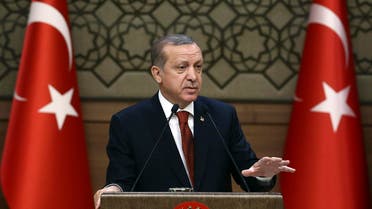 A handout picture taken and released on October 26, 2016 by the Turkish Presidential Press Office shows Turkish President Recep Tayyip Erdogan delivering a speech during the 29th Muhktars Meeting at the Presidential Complex in Ankara. (AFP)