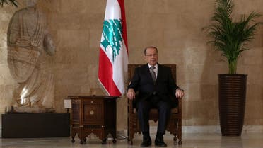 Lebanese president-elect Michel Aoun sits on the presidential chair at the presidential palace in Baabda east of Beirut on October 31, 2016, after he was elected ending a political vacuum of more than two years. The deeply divided parliament took four rounds of voting to elect Aoun, whose supporters flooded streets and squares across the country to celebrate his victory.  PATRICK BAZ / AFP