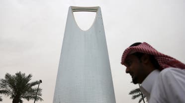 A man walks past the Kingdom Centre Tower in Riyadh, Saudi Arabia April 12, 2016. reuters