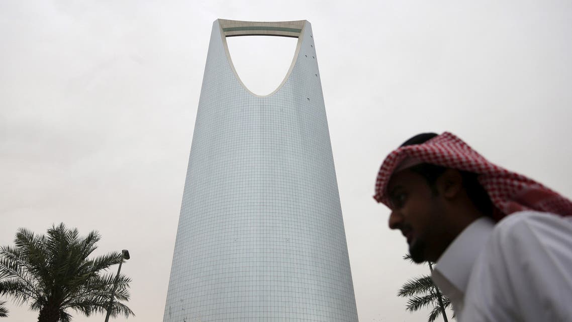 A man walks past the Kingdom Centre Tower in Riyadh, Saudi Arabia April 12, 2016. reuters