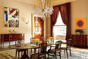 This photo provided by Architectural Digest show the Old Family Dining room in the White House in Washington. Works by Robert Rauschenberg, right, and Alma Thomas, the first African American artist woman represented in the White House, left, make a modern splash. President Barack Obama likes to say the White House is the “people’s house.” Exclusive photos published by Architectural Digest are giving the public its first glimpse of private areas on the second floor of the White House that Obama, his wife, Michelle, daughters Malia and Sasha and family dogs Bo and Sunny have called home for nearly eight years.(Michael Mundy/Architectural Digest via AP)