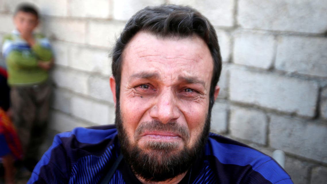Wheelchair-bound man, Abbas Ali, 42, cries with relief after escaping with his wife and four children from the ISIS-controlled village of Abu Jarboa, Iraq October 31, 2016. (Reuters)